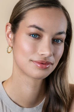 Sale Zinzi 21mm gold plated zilveren halve oorringen 4mm buisdikte, bezet met 12 witte zirconia's en met vlindersluiting ZIO2573Y