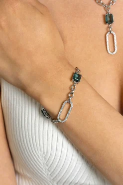 Online Zinzi zilveren fantasie schakel armband met ovale schakel, bezet met witte zirconia's en twee groenachtig blauwe (petrol) kleurstenen in vierpootszetting 18-21cm ZIA2487